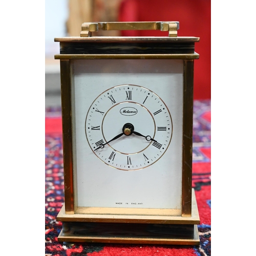 464 - # A brass carriage clock, retailed by Maple & Co., Paris, 15 cm high o/a, to/w another clock wit... 