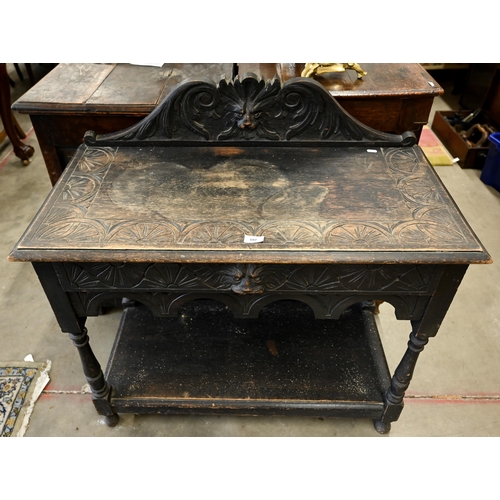 102 - Gothic Revival carved oak side table with single drawer, turned supports and undertier, 92 x 45 x 92... 