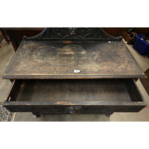 102 - Gothic Revival carved oak side table with single drawer, turned supports and undertier, 92 x 45 x 92... 