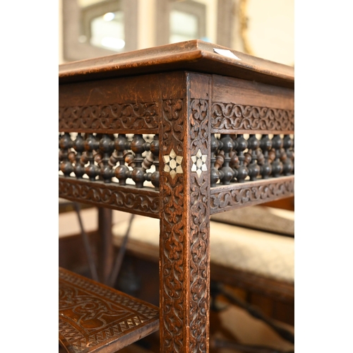 108 - A late 19th century Syrian profusely carved hardwood occasional table inlaid with mother-of-pearl st... 