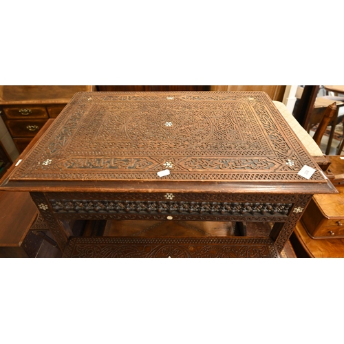 108 - A late 19th century Syrian profusely carved hardwood occasional table inlaid with mother-of-pearl st... 