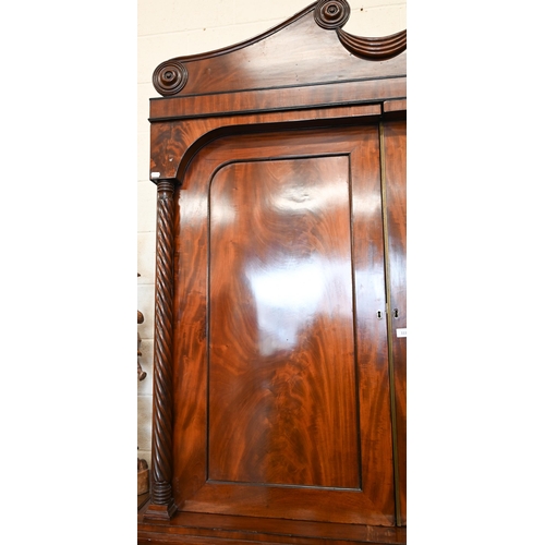 111 - A Georgian mahogany linen press, slides removed and replaced with a hanging rail, enclosed by the pa... 