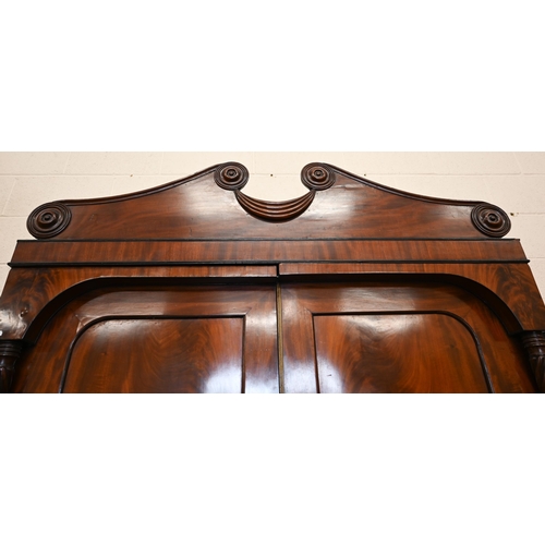 111 - A Georgian mahogany linen press, slides removed and replaced with a hanging rail, enclosed by the pa... 