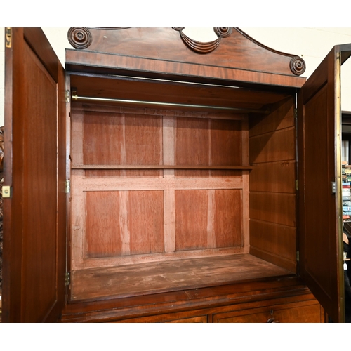 111 - A Georgian mahogany linen press, slides removed and replaced with a hanging rail, enclosed by the pa... 