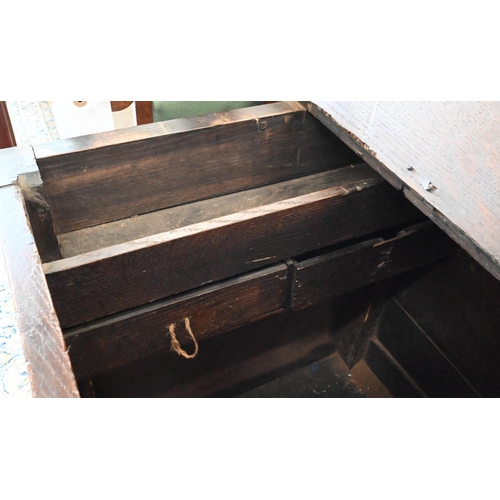 113 - An 18th century panelled oak mule chest with two drawers, 136 x 54 x 84 cm h