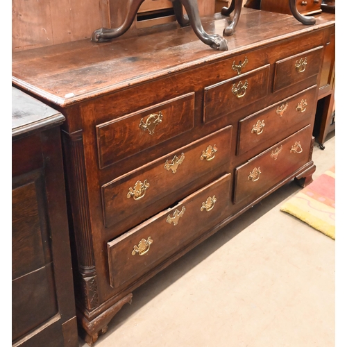 114 - An 18th century oak sideboard (converted) with an arrangement of seven drawers between fluted quarte... 