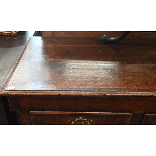 114 - An 18th century oak sideboard (converted) with an arrangement of seven drawers between fluted quarte... 