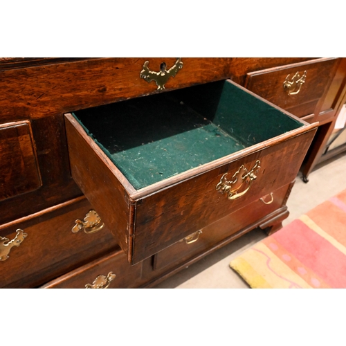 114 - An 18th century oak sideboard (converted) with an arrangement of seven drawers between fluted quarte... 