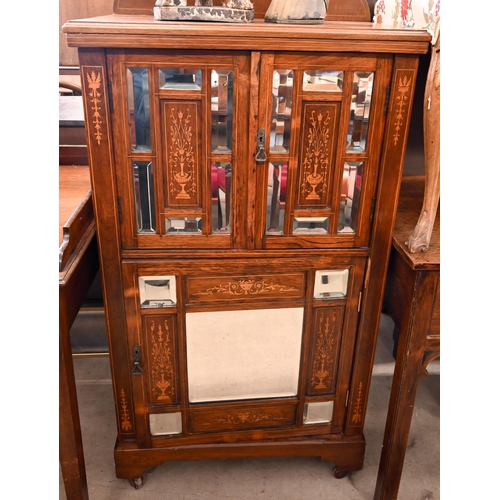 125 - An Edwardian inlaid rosewood music cabinet with mirrored doors, 62 cm wide