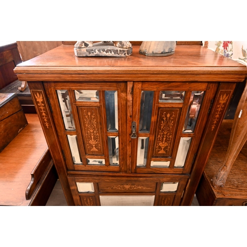 125 - An Edwardian inlaid rosewood music cabinet with mirrored doors, 62 cm wide