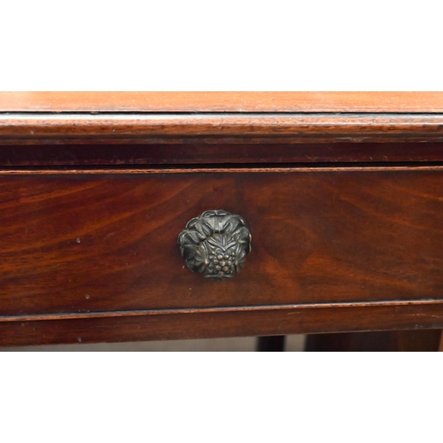 126 - An early 19th century mahogany writing table with three quarter gallery top and long frieze drawer, ... 