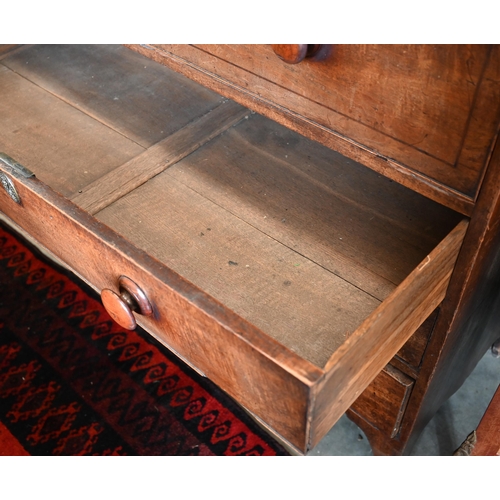 130 - A George III mahogany secretaire chest with fitted drawer above three long drawers, on French bracke... 