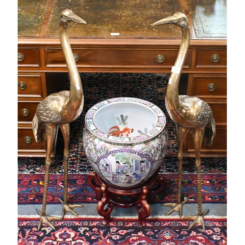 136 - A large Chinese famille rose jardiniere/fish bowl on wooden stand to/with a pair of cast polished br... 