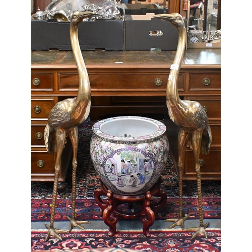 136 - A large Chinese famille rose jardiniere/fish bowl on wooden stand to/with a pair of cast polished br... 