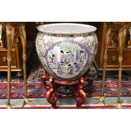 136 - A large Chinese famille rose jardiniere/fish bowl on wooden stand to/with a pair of cast polished br... 