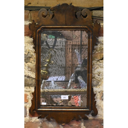 141 - A George III walnut fret-cut wall mirror, with distressed plate, 65 cm x 37 cm h