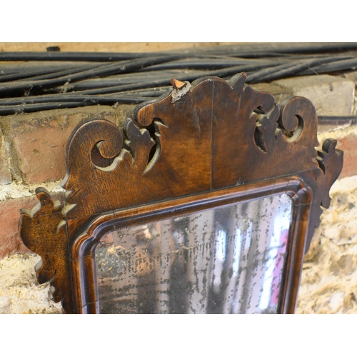 141 - A George III walnut fret-cut wall mirror, with distressed plate, 65 cm x 37 cm h