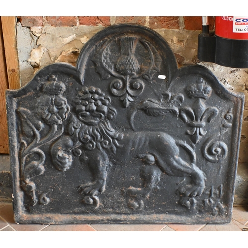 145 - A substantial old cast iron armorial fire back dated 1644, 79 cm x 71 cm to/with an antique copper f... 