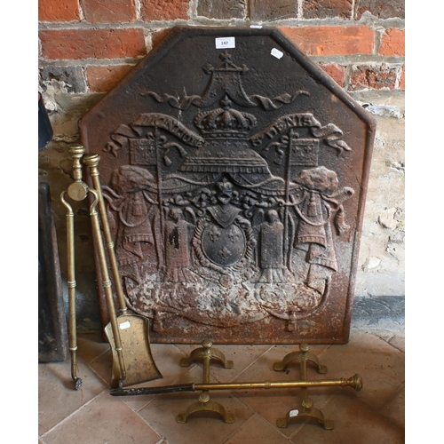 147 - An old French cast iron fireback 'Montjoye St Denis', 81 cm x 64 cm to/with a pair of tool rests, br... 