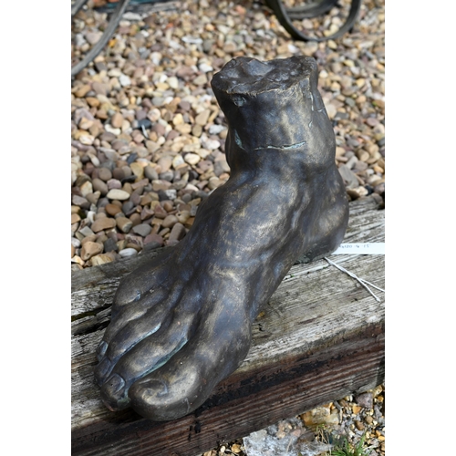 15 - A cast reconstituted stone 'Classical Foot' garden ornament, aged bronzed finish, 50 cm w x 30 cm h