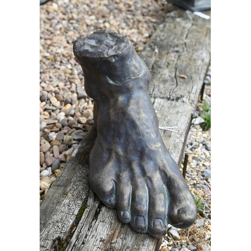 15 - A cast reconstituted stone 'Classical Foot' garden ornament, aged bronzed finish, 50 cm w x 30 cm h