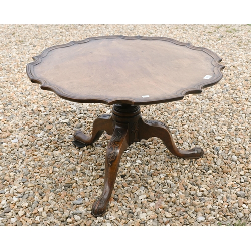 153 - A Victorian mahogany scallop moulded edge tripod table, reduced in height to a coffee table, 77 cm d... 