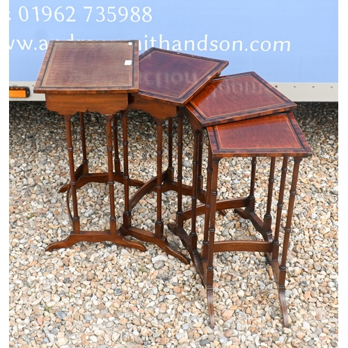 155 - A nest of satinwood quartetto tables, raised on faux bamboo supports, the largest 42 x 32 x 65 cm h