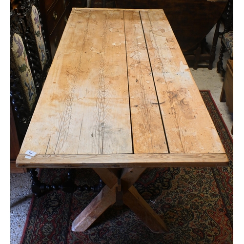 159 - An old pine kitchen table, the cleated end top raised on 'X' frame ends united by a stretcher, 184 x... 