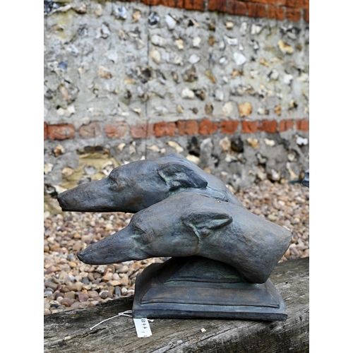 16 - A reconstituted cast stone garden ornament of two greyhound heads in aged bronzed finish, 28 cm high