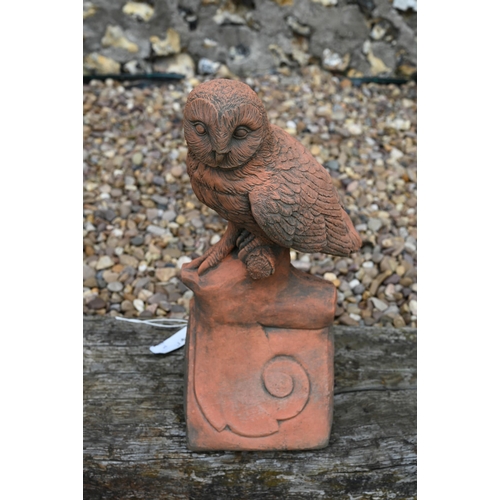 18 - A cast reconstituted aged terracotta owl ridge tile 45 cm high