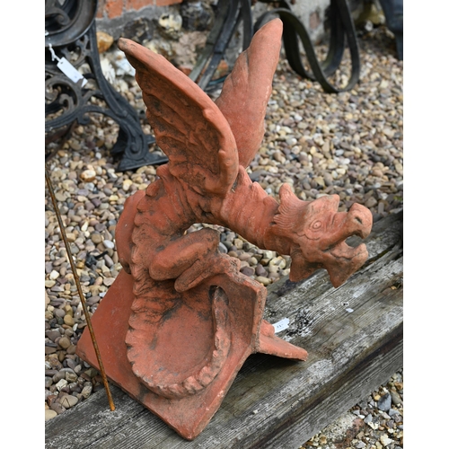 21 - A large cast reconstituted stone 'Welsh Dragon' ridge tile in aged terracotta finish, 60 cm high