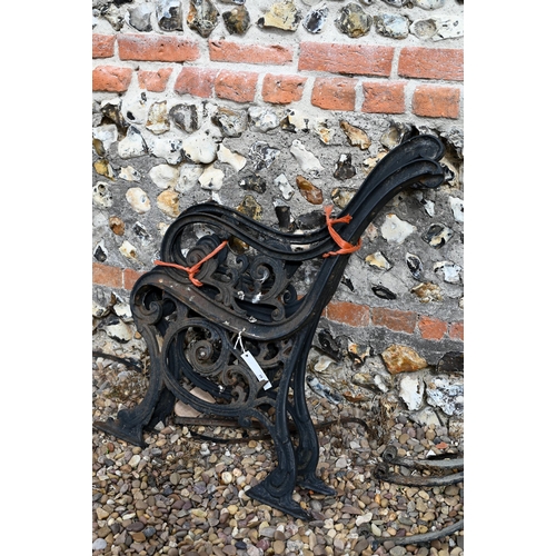 28 - Three wrought iron bench supports to/w another pair of cast iron bench ends