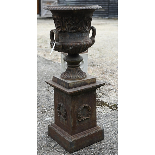 30 - A large pair of old weathered cast iron Campagna urn planters, raised on square pedestal bases, 112 ... 