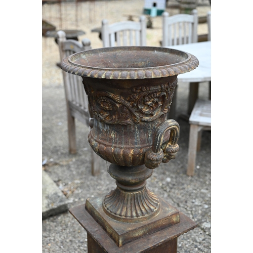 30 - A large pair of old weathered cast iron Campagna urn planters, raised on square pedestal bases, 112 ... 