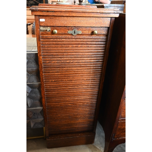 31 - An oak Lebus-style collector's chest with baize lined shelves enclosed by tambour fall front beneath... 