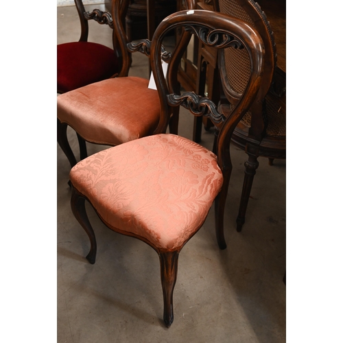 36 - # A set of five Victorian rosewood semi-balloon back dining chairs with carved back rails and stuff-... 