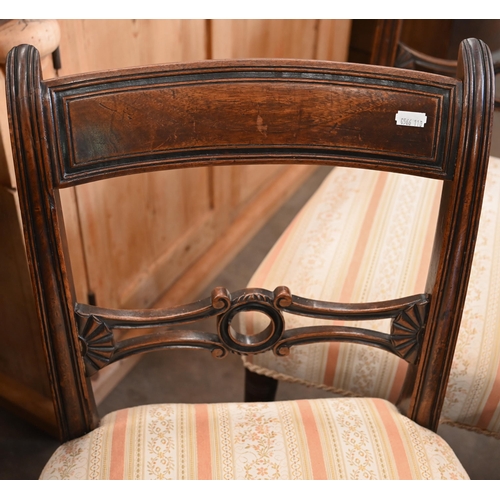 36 - # A set of five Victorian rosewood semi-balloon back dining chairs with carved back rails and stuff-... 