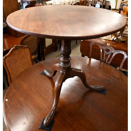 37 - # A Georgian mahogany tripod tea table on baluster pillar, 83 cm diam