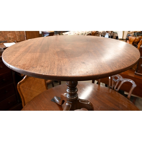 37 - # A Georgian mahogany tripod tea table on baluster pillar, 83 cm diam