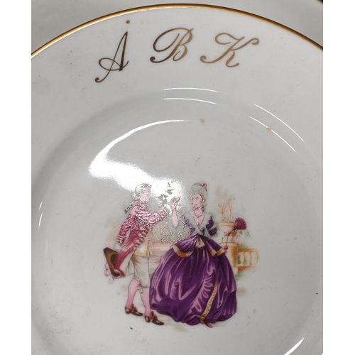 430 - A Limoges dinner service, printed with an 18th century couple and gilt initials 'ABK' (2 boxes)