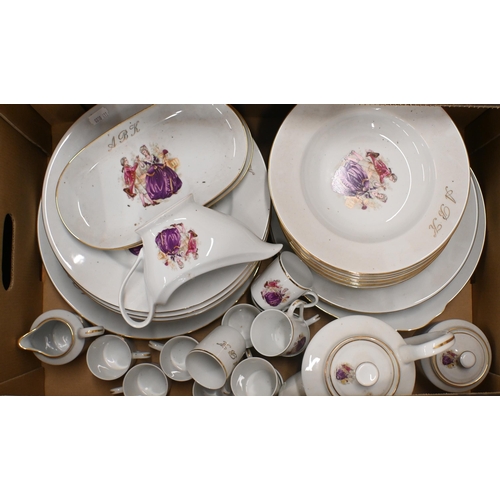 430 - A Limoges dinner service, printed with an 18th century couple and gilt initials 'ABK' (2 boxes)