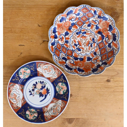 435 - A pair of 19th century Imari palette porcelain plates, painted with bamboo, 23 cm to/w a Japanese Im... 