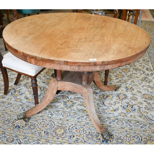 44 - A Regency rosewood breakfast table with 110 cm tilt-top, on four turned pillars to platform base and... 