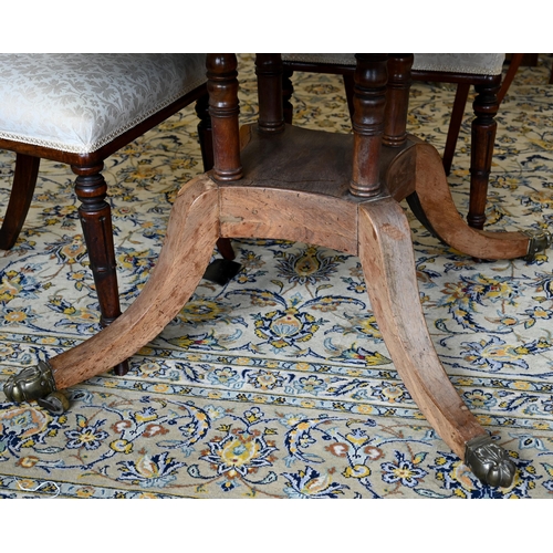 44 - A Regency rosewood breakfast table with 110 cm tilt-top, on four turned pillars to platform base and... 