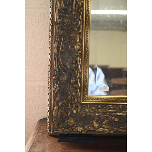 46 - A large gilt framed wall mirror with bevelled plate, 158 x 125 cm