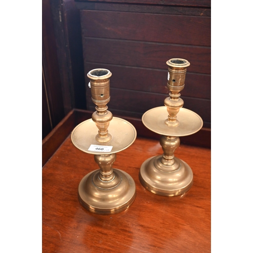 460 - An antique pair of tavern candlesticks, the baluster stems fitted with dishes 26 cm high (sconces dr... 