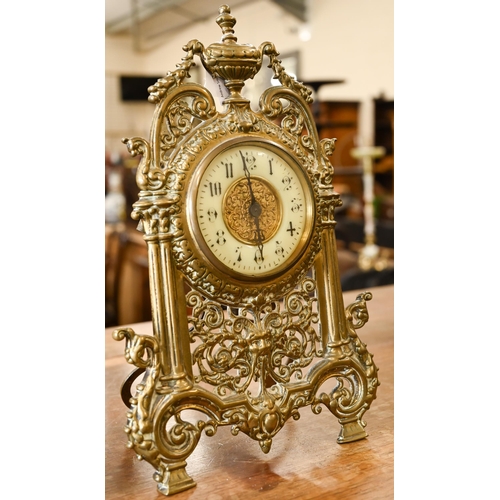 463 - An antique mantel clock with drum movement in ornate Florentine brass strut frame, 32 cm high