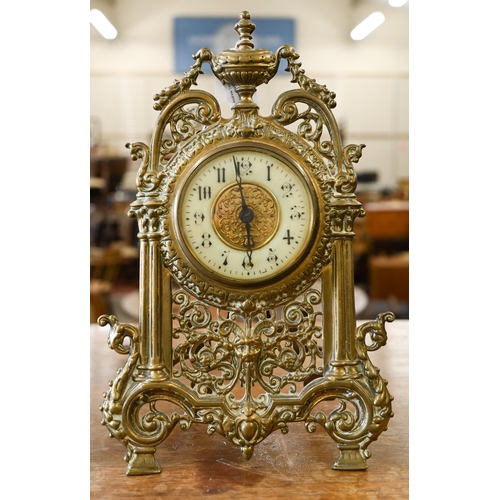 463 - An antique mantel clock with drum movement in ornate Florentine brass strut frame, 32 cm high