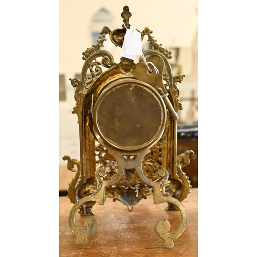 463 - An antique mantel clock with drum movement in ornate Florentine brass strut frame, 32 cm high