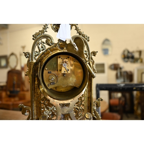 463 - An antique mantel clock with drum movement in ornate Florentine brass strut frame, 32 cm high